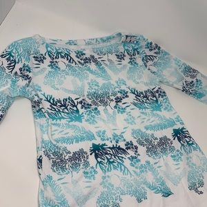 A teal and blue coral blouse from Charter Club